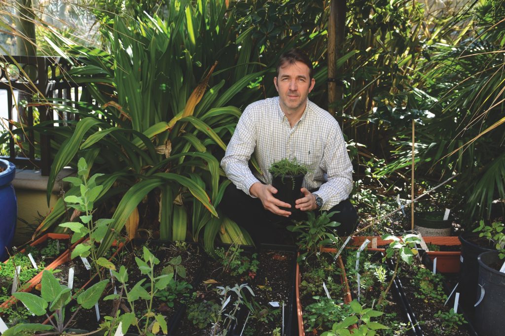 Geoffrey-Abbott surrounded by plants