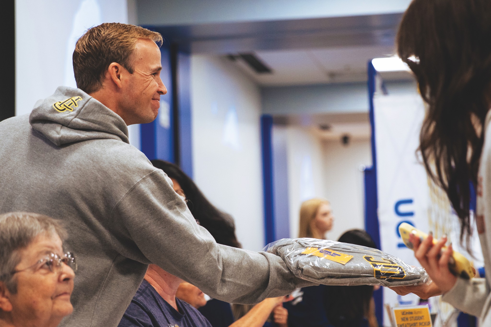 Handing out a sweatshirt