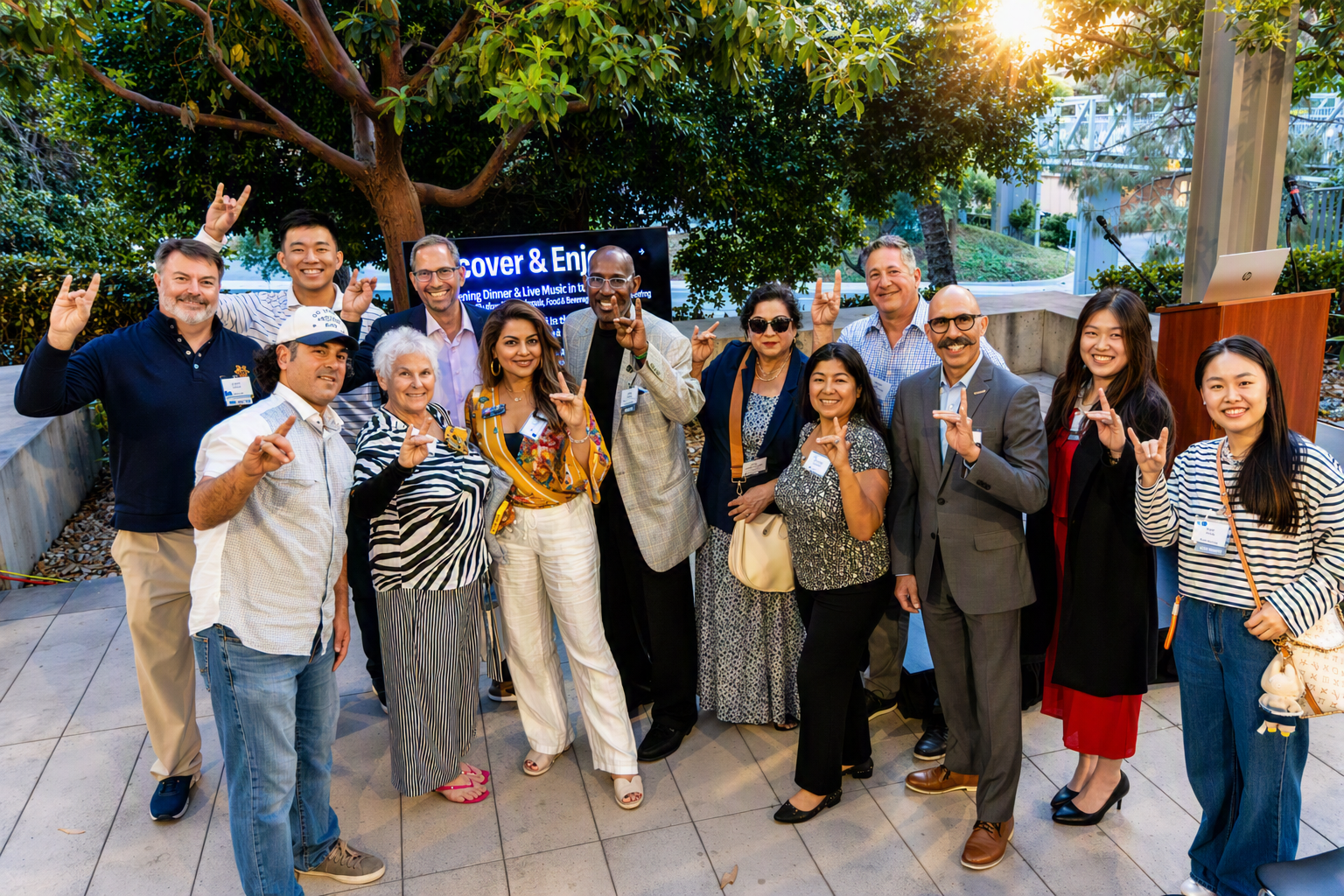 Medical students at a UC Irvine Match Day event hold signs showing their residency placements at Cedars-Sinai, Cornell, UC Riverside, and Thomas Jefferson.