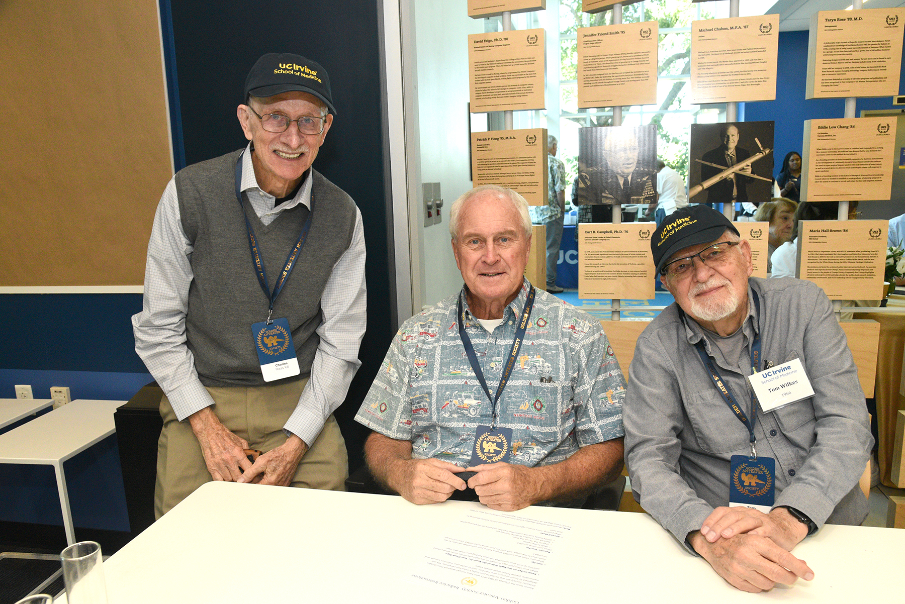 Three Golden Anteater Society members seated together at a UC Irvine Alumni celebration event.