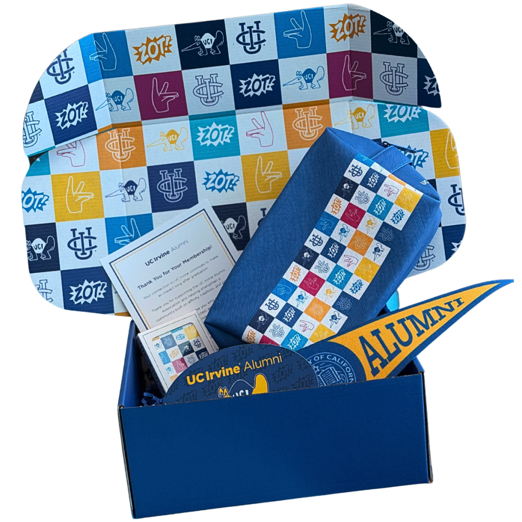 UC Irvine Alumni membership welcome box containing branded gifts, including a patterned bucket hat, tote bag, pennant, card, and alumni-themed merchandise.
